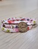 "Detente" Wrap Pulsera/gargantilla · Disco acero y cordón tela flores
